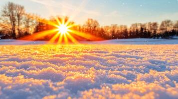 The sun is shining over a snow covered field photo