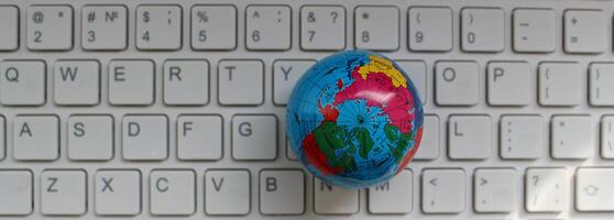 Globe Model On Computer Keypad With Latin Characters Only Top View photo