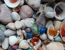 Pattern Of Colorful Quartz Stones On A Sea Mix With Sea Rocks And Shells. Aquarium Soil Backgrounds photo