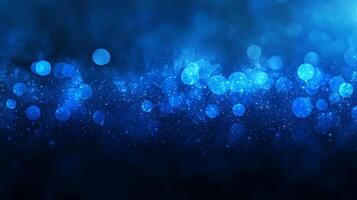 Enigmatic blue bokeh cascade sparkling on a subtly darkened backdrop photo