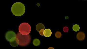 Flying colorful bubbles in black background video