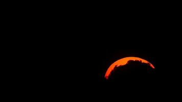 Beautiful sunset over mountains creating a stunning silhouette during twilight hours in the evening sky video