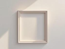 An empty white frame on a wall photo