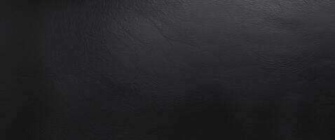 Black leather texture background with a smooth and matte finish suitable for design and textile applications. photo