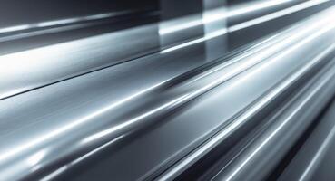 Shiny metallic surface with light beams creating a gradient effect of dark and bright areas photo