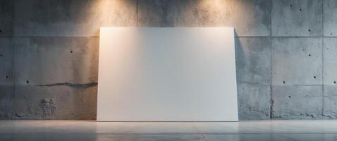 Blank canvas on empty space with concrete wall background and floor lighting photo