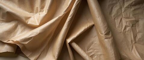Soft and textured kraft paper drapes gently with natural folds and creases for a rustic feel photo