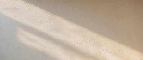 Textured Venetian plaster with soft shadows in bright background for creative design. photo