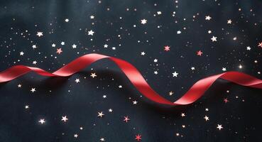 Red ribbon with stars on black background photo