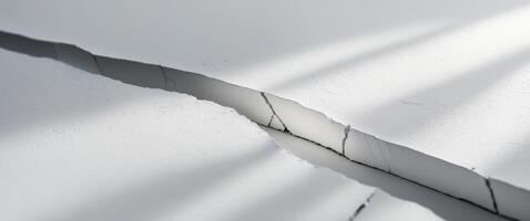 White surface showing crack separating two parts. photo