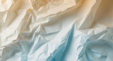 Abstract background of crumpled white paper showing a gradient of warm and cool colors. photo