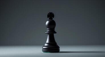 Black chess pawn positioned on a dark surface with intriguing lighting effects. photo