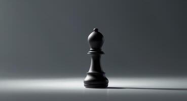 Black chess pawn positioned on a dark surface with intriguing lighting effects photo