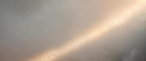 A white wall with a light shining through it photo