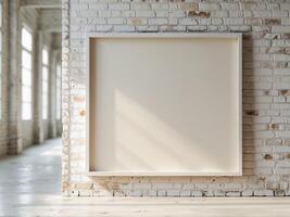 Empty white frame on a brick wall in an empty room photo