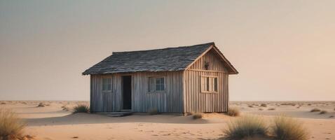 An old wooden house in the middle of the desert photo