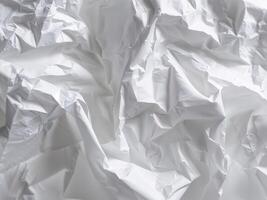 Crumpled White Paper Texture for Background or Overlay Use. photo