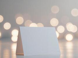 A blank card sitting on a table with a blurred background photo