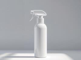 A white spray bottle on a table with a window photo