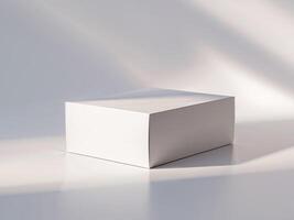 White box on a white surface with shadows photo