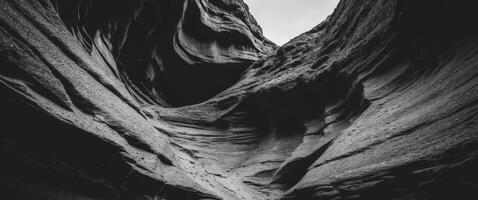 Halftone texture reveals canyon walls with deep crevices and shadows under light. photo