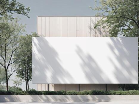 A large white billboard sits in front of a building with trees in the background photo