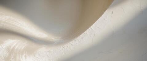 A white and cream colored wall with a wave photo