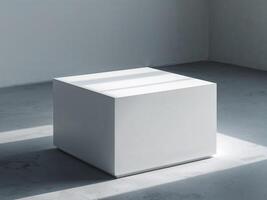 A white cube sitting on a concrete floor photo