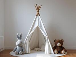 A white teepee with a bunny and bear plush toy sitting in front of a white wall and wood floor photo