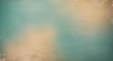 Soft lighting and gradient color design on teal background transitioning to beige with vintage grunge texture photo