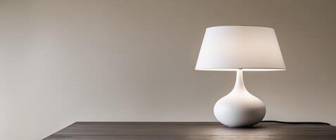 a close up of a lamp on a table with a white shade. photo