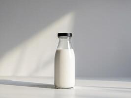 Clear Pixel Image of a Bottle of Milk with a Black Cap on it photo