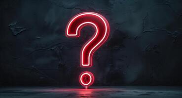 A red question mark is shown in front of a dark wall photo