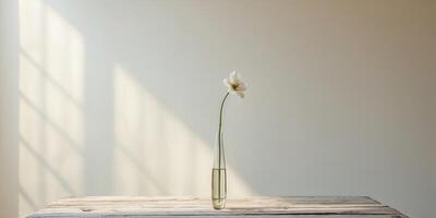 Vase with flower on table in bright room with natural light and soft background photo