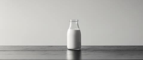 there is a bottle of milk sitting on a table. photo