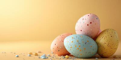 Colorful speckled eggs arranged on a vibrant yellow background for spring celebrations photo