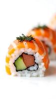 Sushi roll with salmon, cucumber, and avocado on a white plate photo