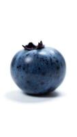 Extreme closeup of a single blueberry showcasing rich texture and color photo