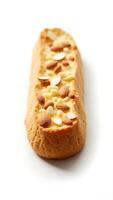 Detailed closeup of a biscuit filled with nuts and cream on a plain background photo