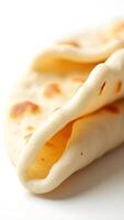 Closeup view of freshly made flatbread stacked with soft texture and rich patterns photo