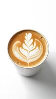 Closeup view of expertly crafted latte art in a coffee cup on a simple background photo