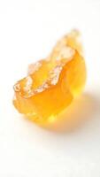Extreme closeup of a translucent yellow crystal highlighting its unique texture and form photo