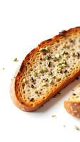 Closeup of a slice of bread topped with seeds and grains on a plain background photo