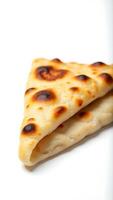 Extreme closeup of freshly baked naan bread with golden brown spots photo
