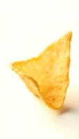Extreme closeup of a unique triangular tortilla chip against a plain background photo