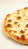Closeup view of freshly baked bread with a golden-brown crust and air bubbles photo