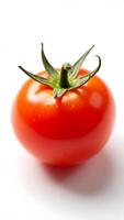 Closeup view of a ripe red tomato with green stem on a bright white surface photo