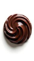Closeup of smooth, swirled chocolate texture on a plain surface for culinary presentation photo
