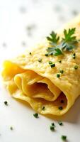 Closeup of a delicious omelette garnished with fresh herbs on a white plate photo