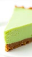 Closeup view of a slice of green dessert with a golden crust on a plate photo